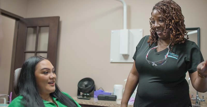 patient smiling during her visit to Tulsa Premier Dentistry